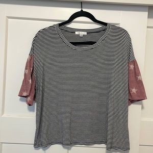 Striped shirt with star sleeves. Very cute and comfortable. Easy to dress up.